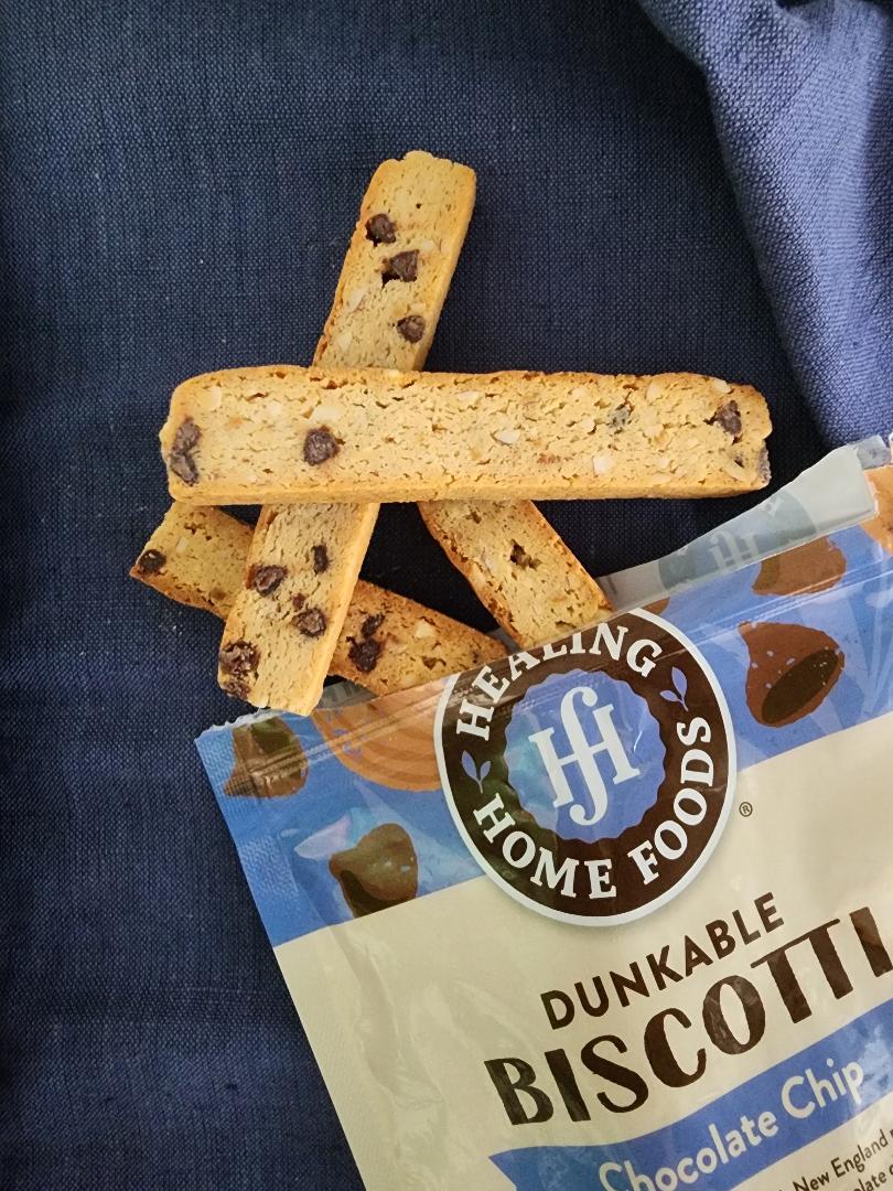 Dunkable Biscotti with chocolate chips on a blue background, featuring Healing Home Foods packaging.